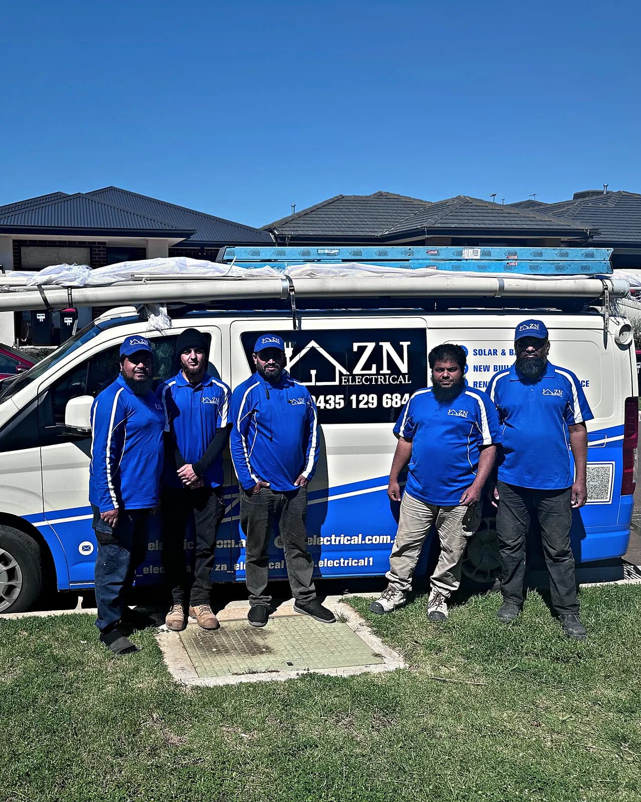 The ZN Electrical team standing beside their branded van